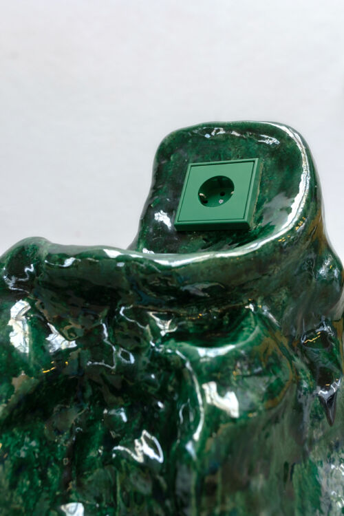 detail of a design object green glazed rock with a socket by dutch invertuals for 5tracks interior design