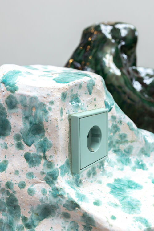 detail of two design objects green glazed rocks with sockets by dutch invertuals for 5tracks interior design