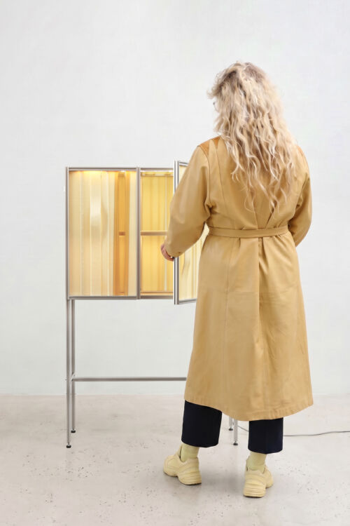 Wendy plomp with butter honey yellow slumped glass cabinet with aluminium extrusion profile frame design by dutch invertuals